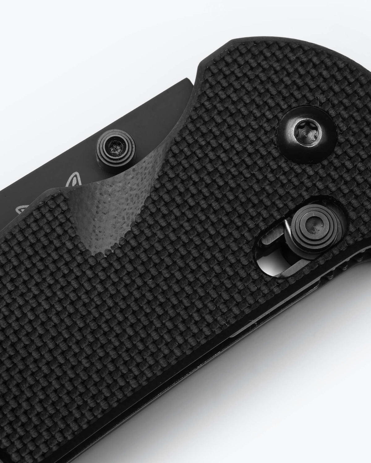 Benchmade Triage® Black G10 Handle Detail - Textured Grip Close-up | Benchmade Knife Co.
