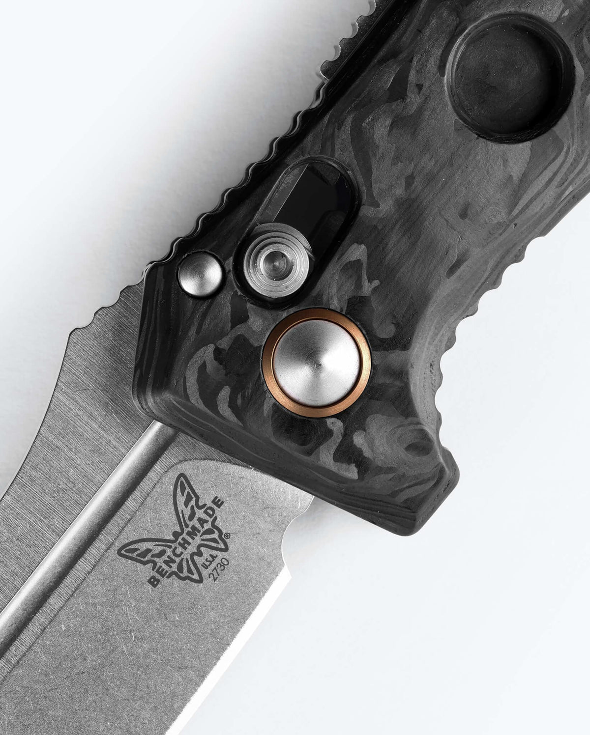Mini Auto Adamas® Marbled Carbon Fiber Drop-point - AXIS Lock Mechanism Close-up | Benchmade Knife Co.